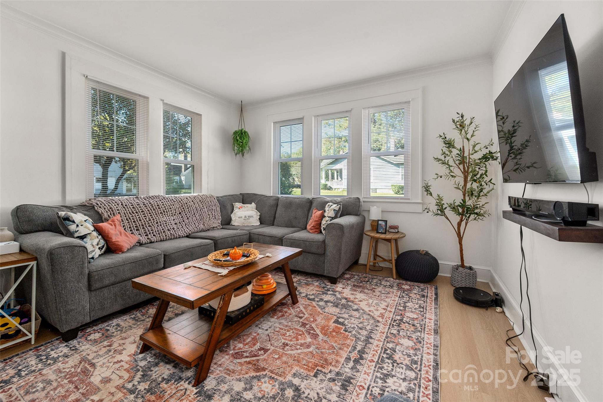 900 Chesterfield Avenue Lancaster, SC 29720 - Photo 6 of 37 a living room with furniture a flat screen tv and a window