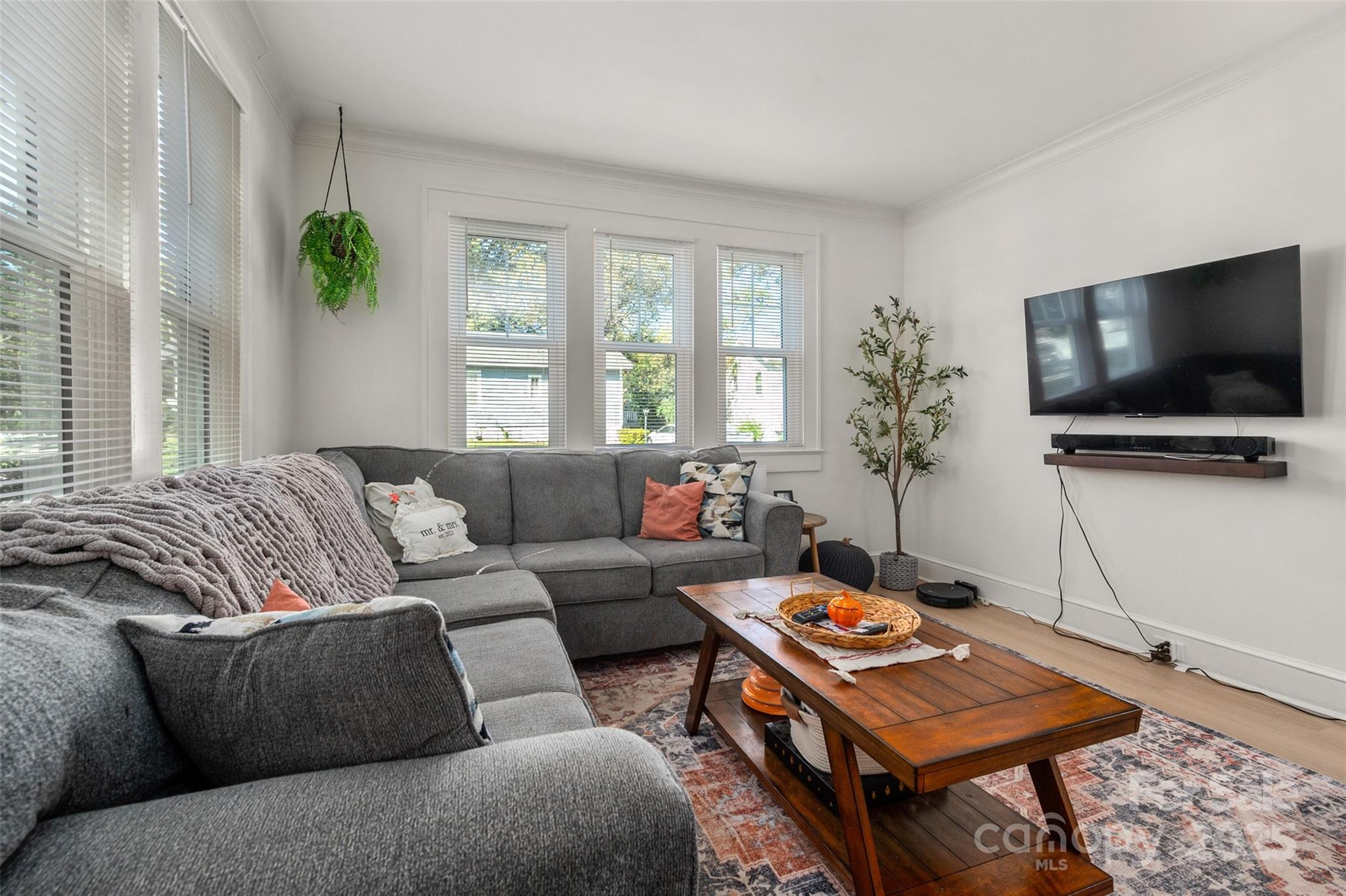 900 Chesterfield Avenue Lancaster, SC 29720 - Photo 7 of 37 a living room with furniture a flat screen tv and a window