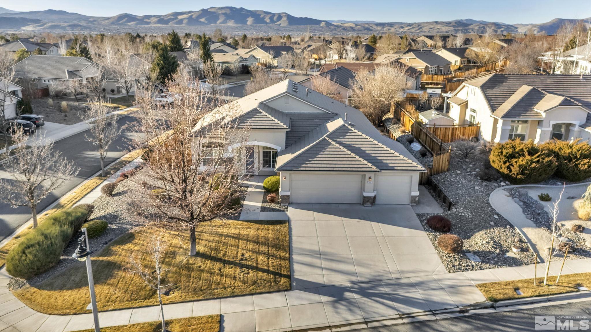 7301 Lacerta Drive Sparks, NV 89436 - Photo 1 of 39 an aerial view of a house with a yard