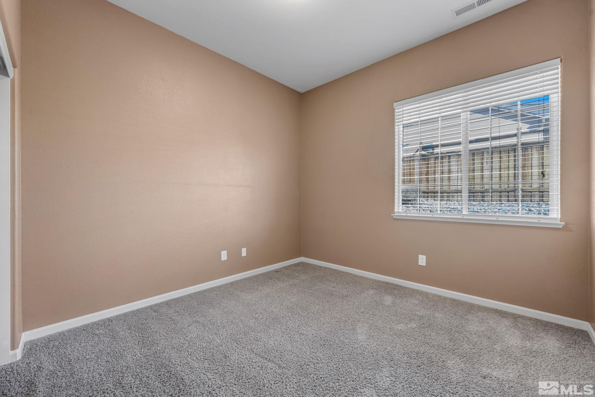 7301 Lacerta Drive Sparks, NV 89436 - Photo 29 of 39 an empty room with windows