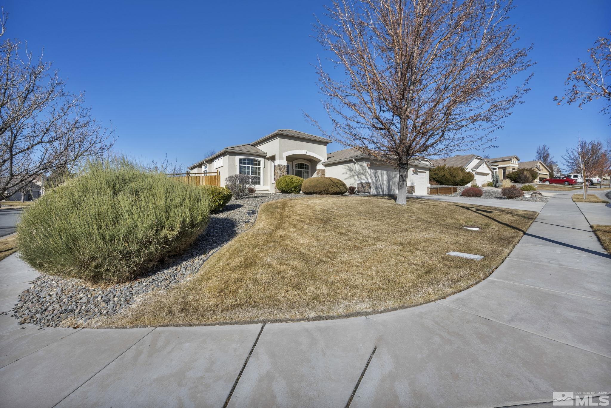 7301 Lacerta Drive Sparks, NV 89436 - Photo 3 of 39 a view of a house with a yard