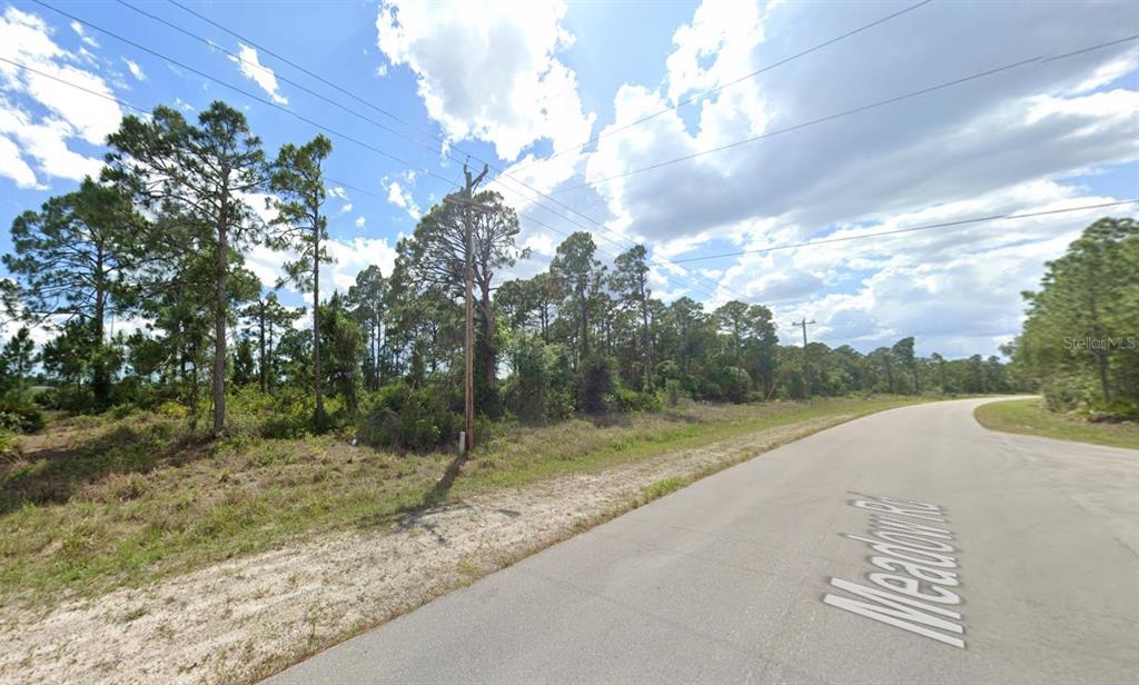 2526 Meadow Road Lehigh Acres, FL 33974 - Photo 1 of 1 a view of a street