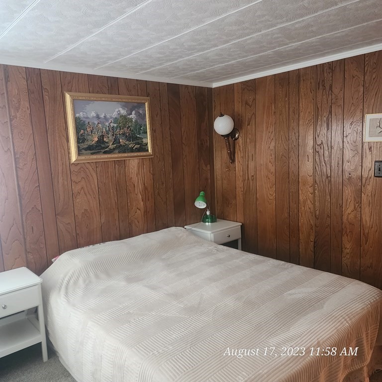 22 Windbrook Drive Auburn, MA 01501 - Photo 11 of 19 a bedroom with a bed and a painting on the wall