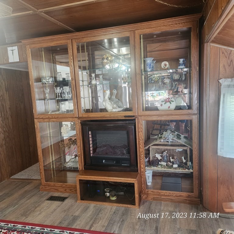 22 Windbrook Drive Auburn, MA 01501 - Photo 13 of 19 a living room with fireplace furniture and a floor to ceiling window