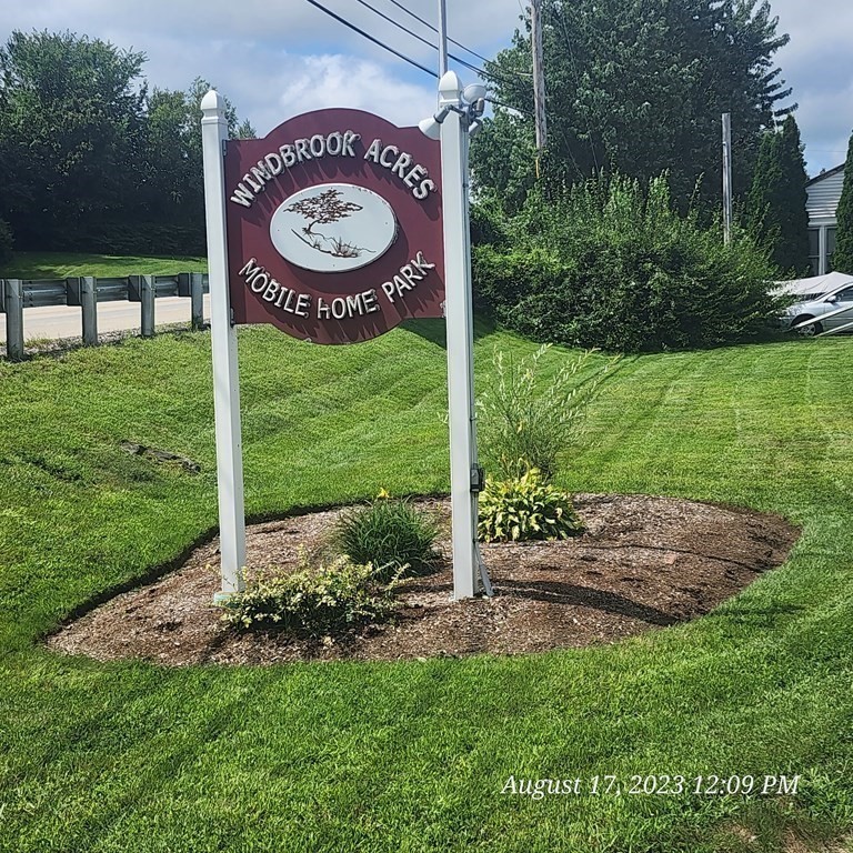 22 Windbrook Drive Auburn, MA 01501 - Photo 19 of 19 a view of an house with backyard space and balcony