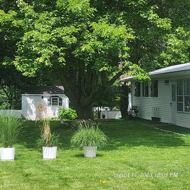 22 Windbrook Drive Auburn, MA 01501 - Photo 5 of 19 a garden view with a seating space