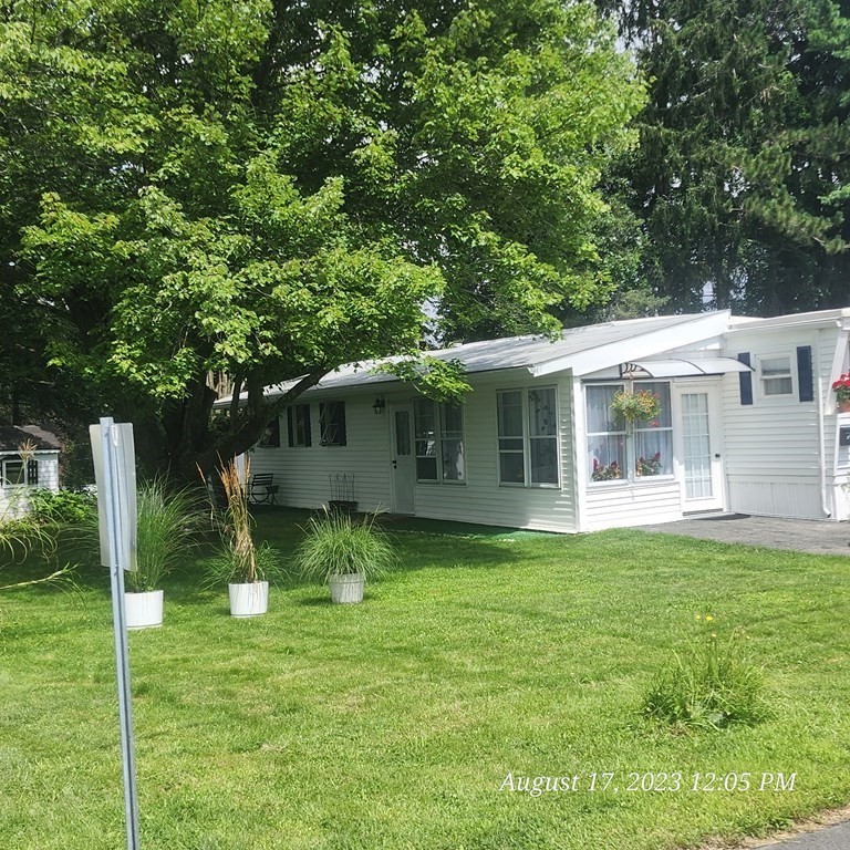 22 Windbrook Drive Auburn, MA 01501 - Photo 6 of 19 a front view of a house with a garden