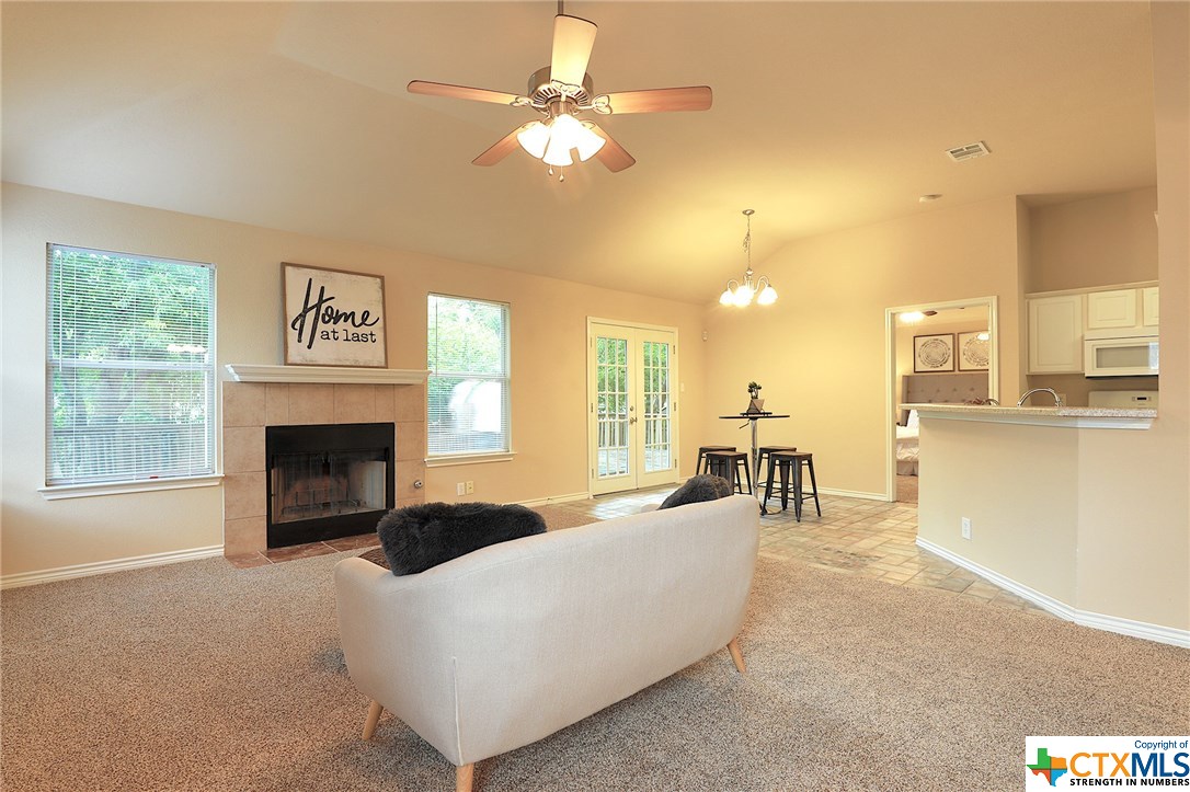 2346 Friarcreek Loop Round Rock, TX 78664 - Photo 1 of 1 a living room with furniture a fireplace and a flat screen tv