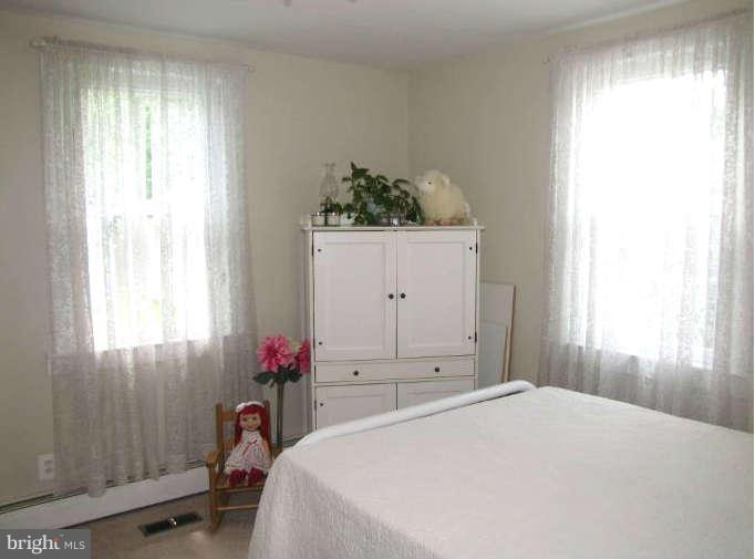 1017 Minnetonka Road Severn, MD 21144 - Photo 14 of 23 a bedroom with a bed and a window