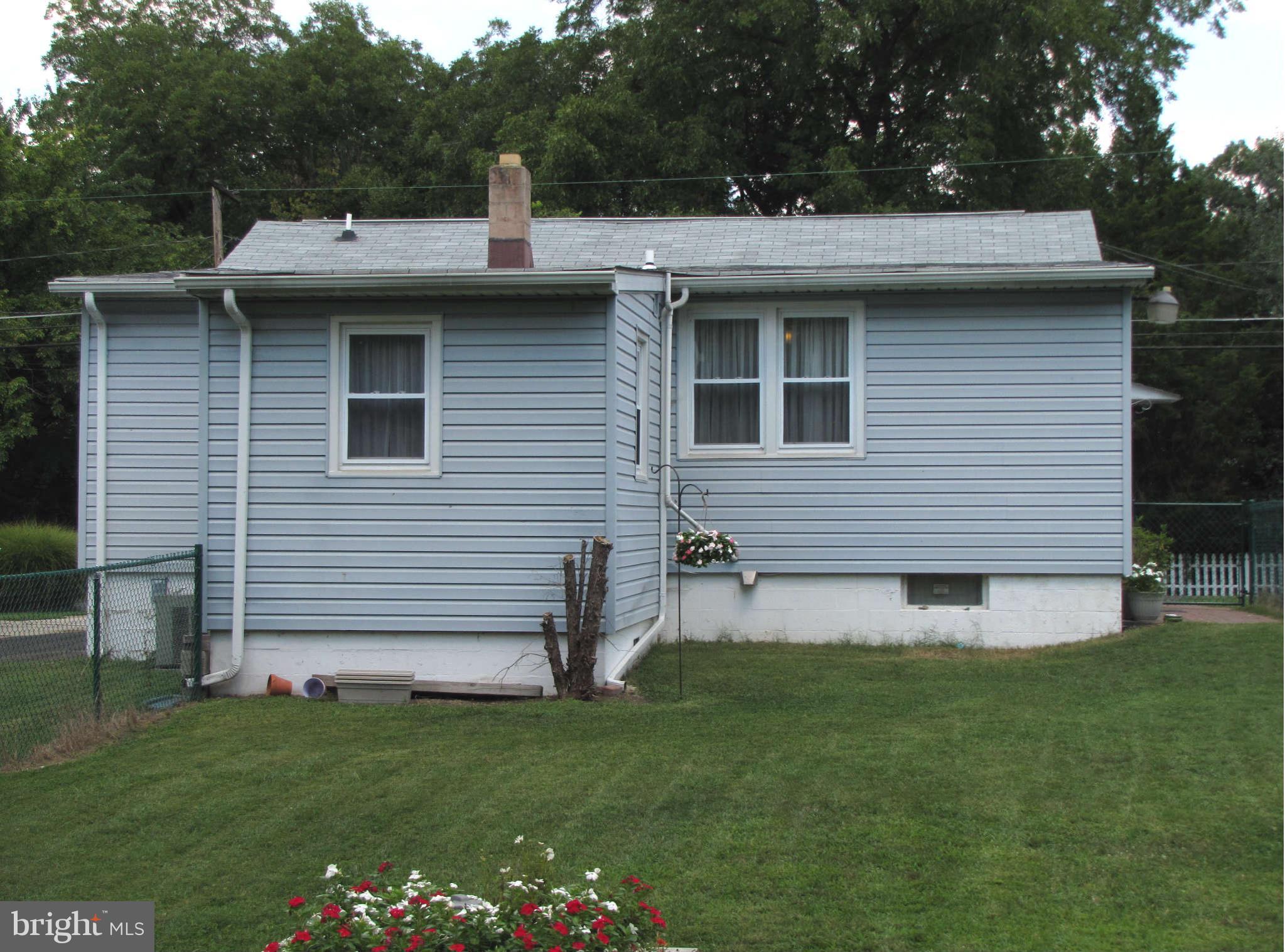1017 Minnetonka Road Severn, MD 21144 - Photo 23 of 23 a front view of a house with a garden