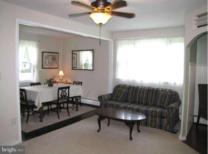1017 Minnetonka Road Severn, MD 21144 - Photo 5 of 23 a living room with furniture and a chandelier