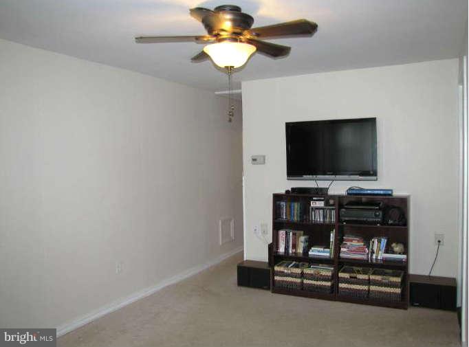 1017 Minnetonka Road Severn, MD 21144 - Photo 6 of 23 a flat screen tv on the wall and a flat screen tv