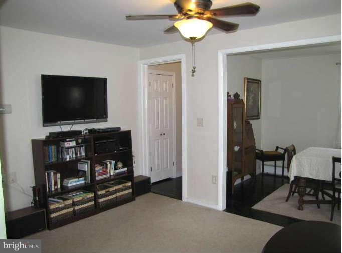 1017 Minnetonka Road Severn, MD 21144 - Photo 7 of 23 a living room with furniture and a flat screen tv
