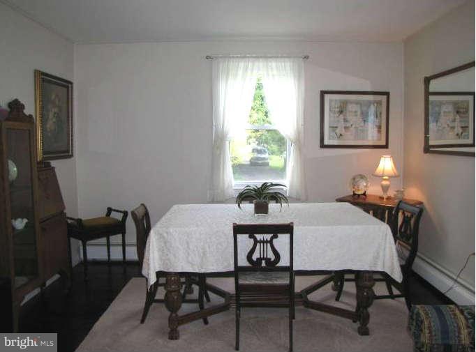1017 Minnetonka Road Severn, MD 21144 - Photo 8 of 23 a view of a dining room with furniture and a window