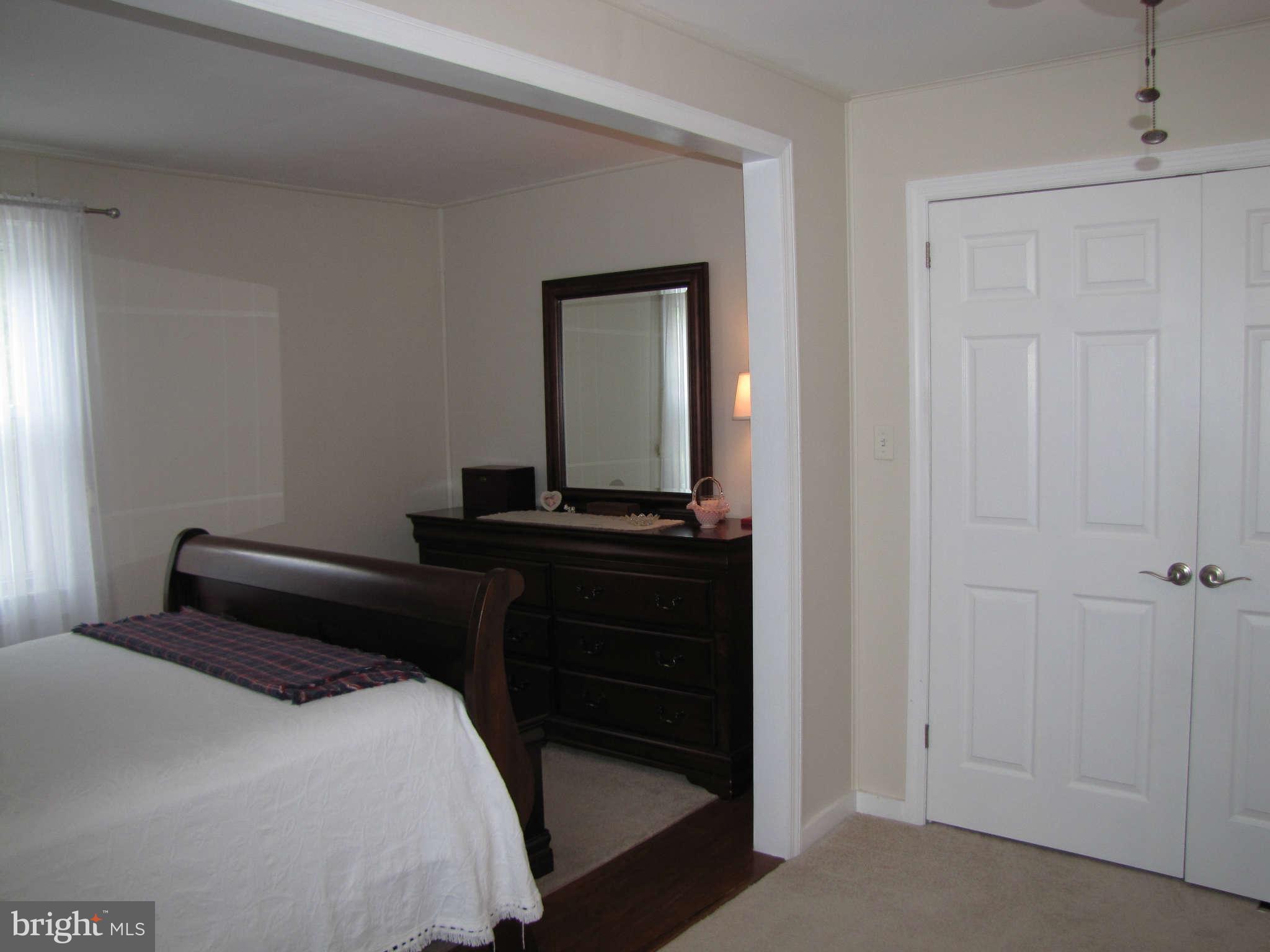 1017 Minnetonka Road Severn, MD 21144 - Photo 10 of 23 a bedroom with a bed and a dresser
