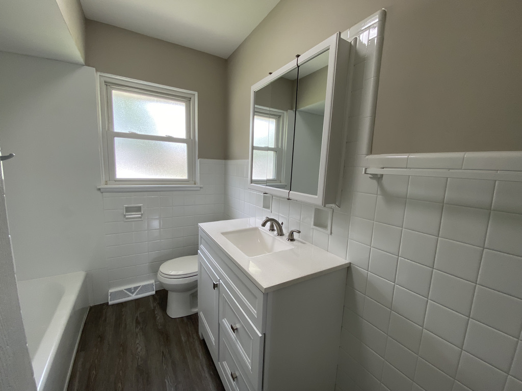 201 Pine Street Villa Park, IL 60181 - Photo 11 of 17 a bathroom with a sink toilet and mirror