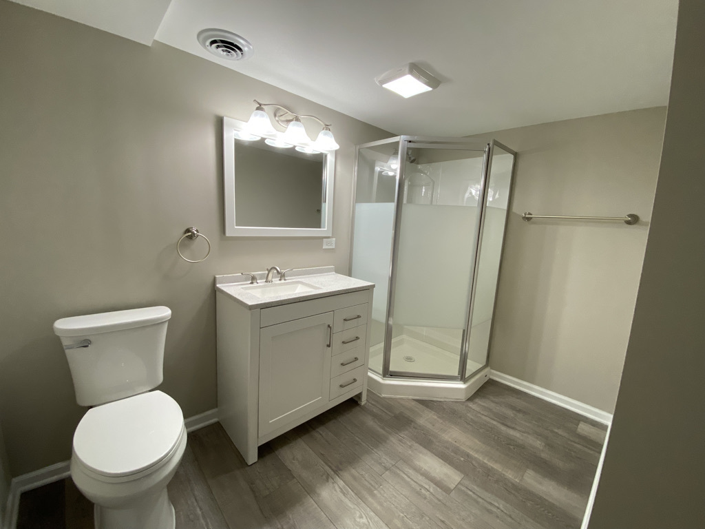 201 Pine Street Villa Park, IL 60181 - Photo 14 of 17 a bathroom with a granite countertop sink toilet and shower
