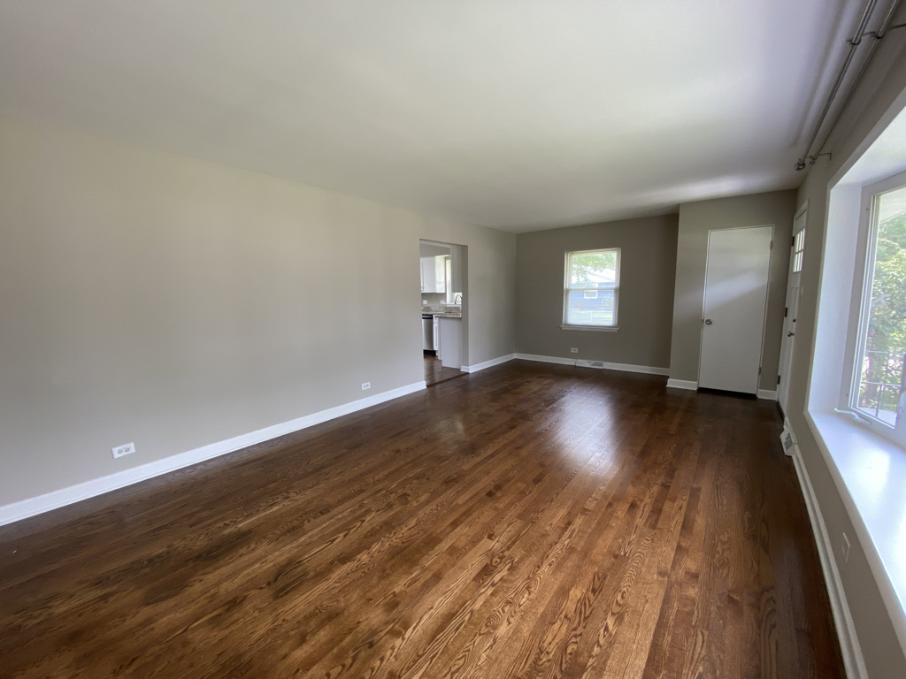 201 Pine Street Villa Park, IL 60181 - Photo 3 of 17 wooden floor in an empty room with a window