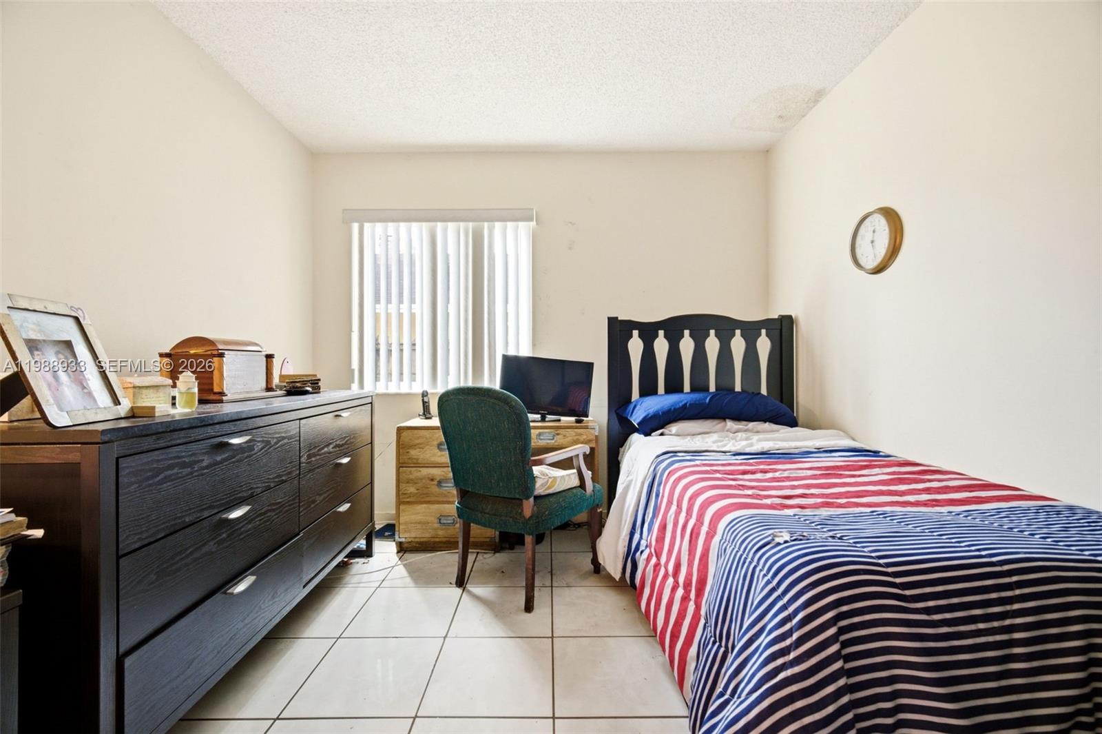 841 Southwest 55th Avenue Margate, FL 33068 - Photo 23 of 26 a bedroom with a bed and wooden floor