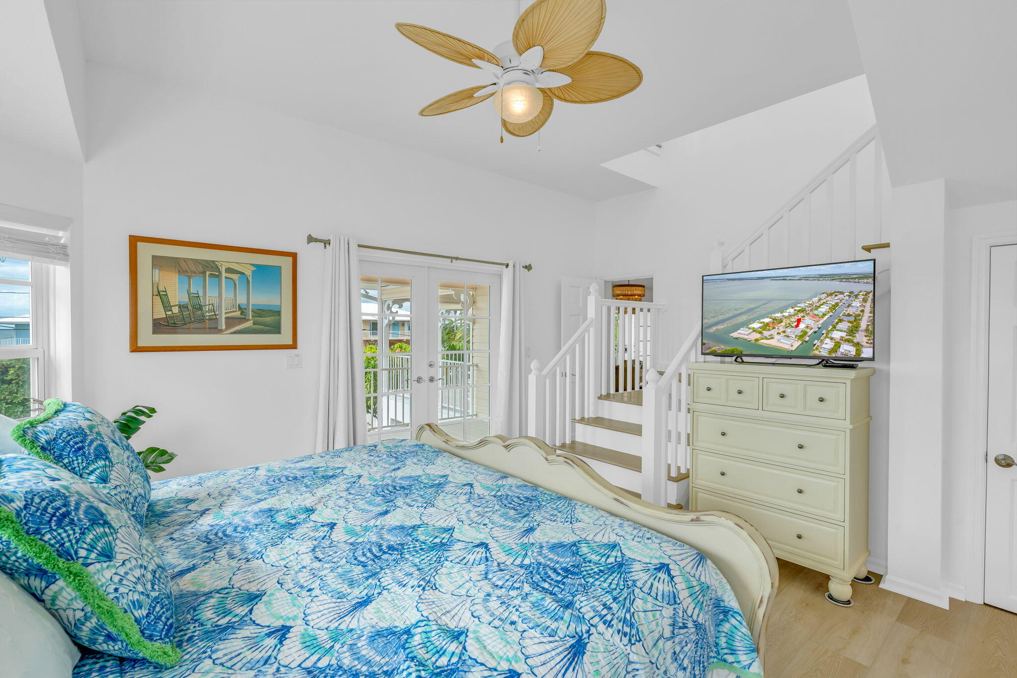 1147 Flagship Drive Summerland Key, FL 33042 - Photo 20 of 53 a bedroom with a bed and a dresser