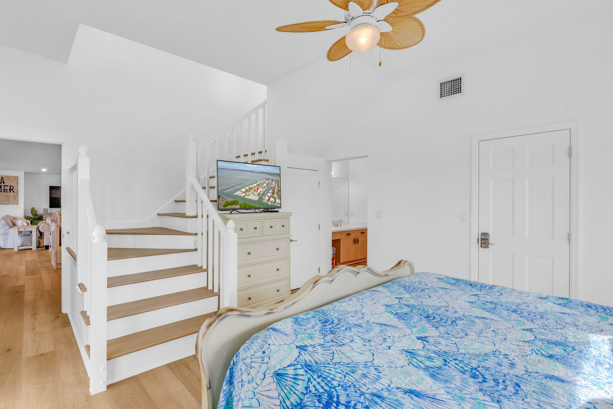 1147 Flagship Drive Summerland Key, FL 33042 - Photo 21 of 53 a bedroom with a bed and a dresser