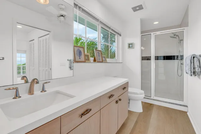 a spacious bathroom with a double vanity sink mirror and