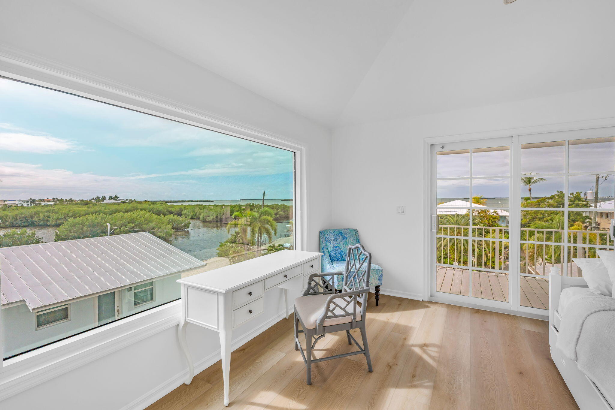 1147 Flagship Drive Summerland Key, FL 33042 - Photo 25 of 53 a living room with furniture tv and a large window