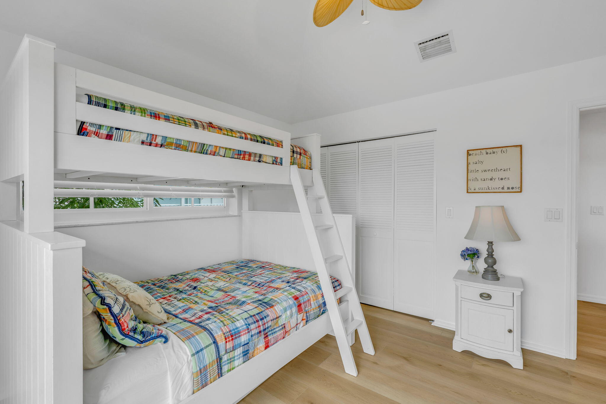 1147 Flagship Drive Summerland Key, FL 33042 - Photo 30 of 53 a bedroom with a bed and wooden floor