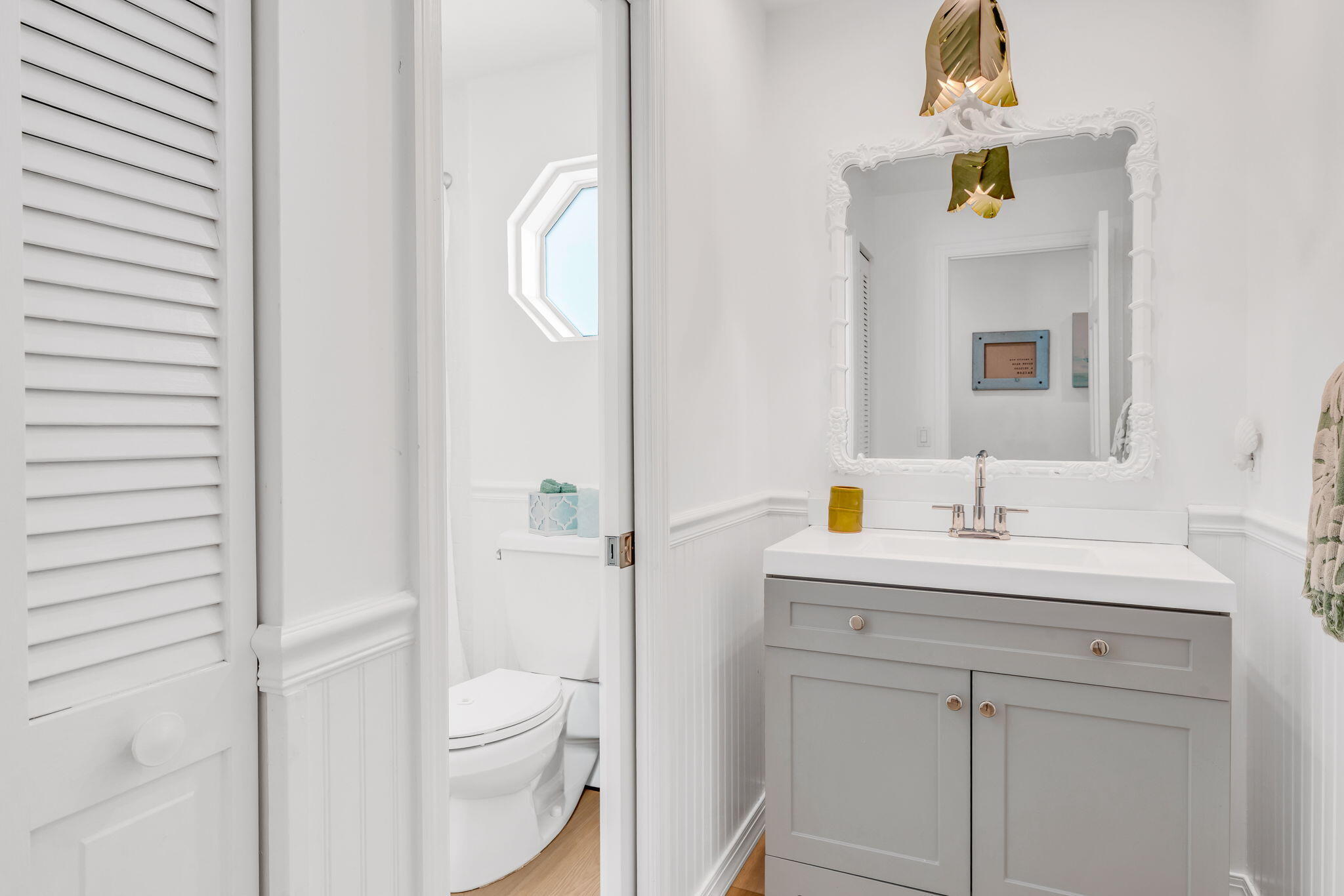 1147 Flagship Drive Summerland Key, FL 33042 - Photo 31 of 53 a bathroom with a toilet sink vanity and mirror