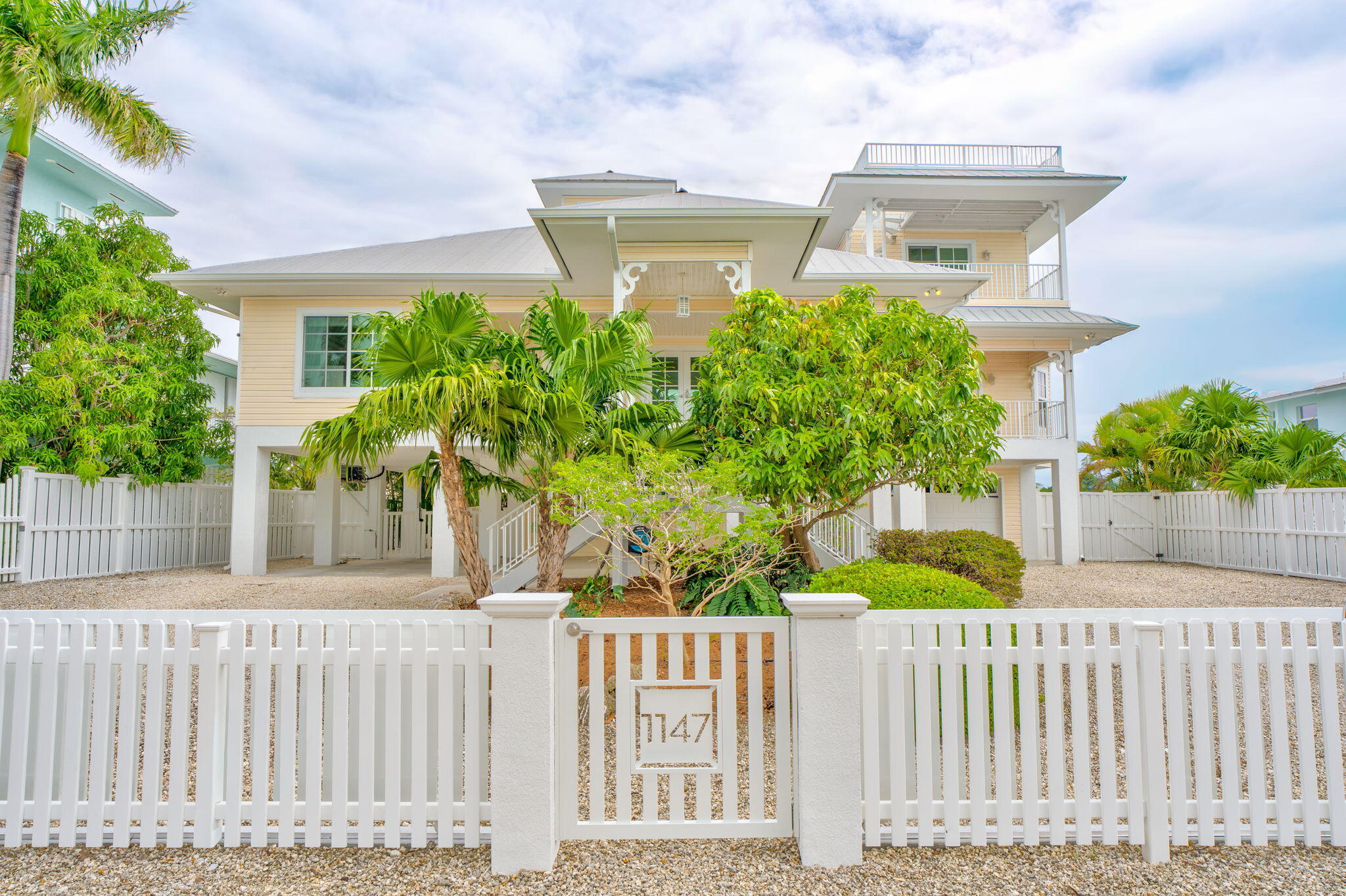 1147 Flagship Drive Summerland Key, FL 33042 - Photo 42 of 53 a front view of a house with a garden