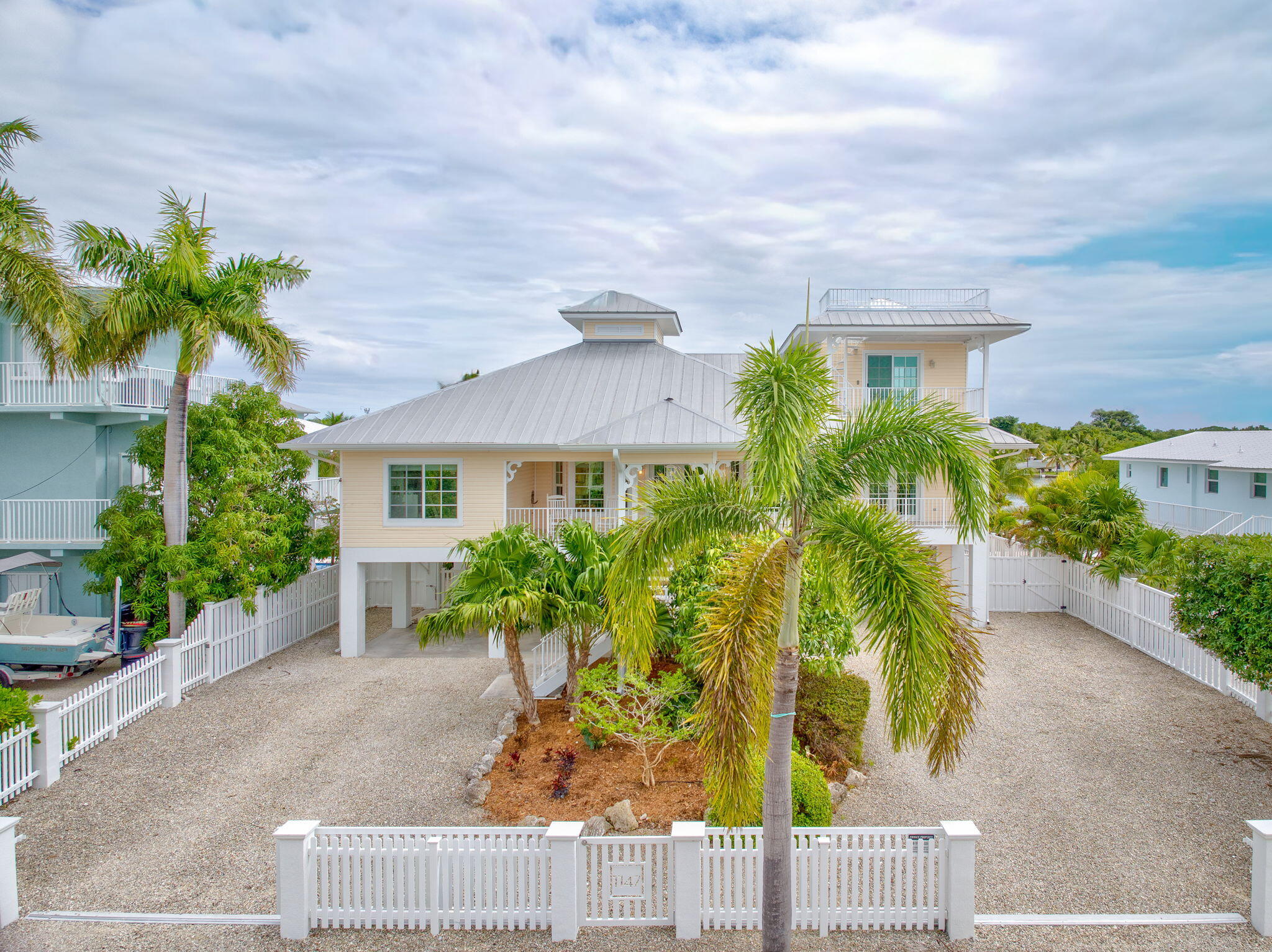 1147 Flagship Drive Summerland Key, FL 33042 - Photo 45 of 53 a view of a house with a yard and potted plants