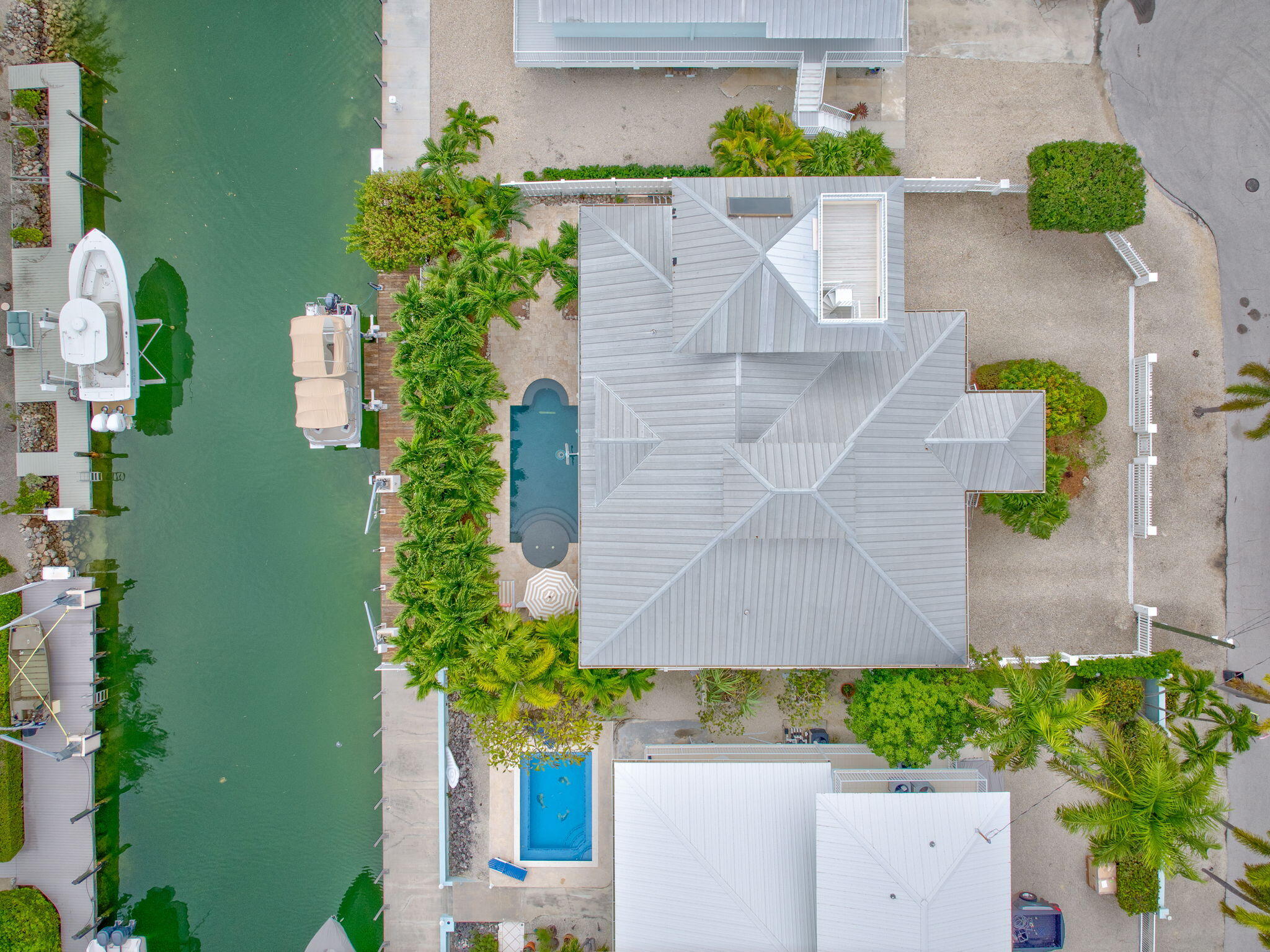1147 Flagship Drive Summerland Key, FL 33042 - Photo 53 of 53 a aerial view of a house with a yard and garden