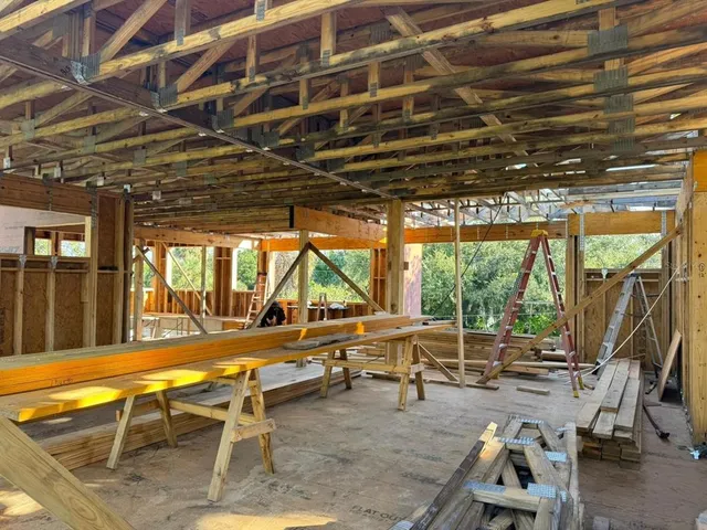 a view of a swimming pool with outdoor seating