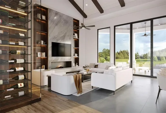 a living room with furniture a flat screen tv and a floor to ceiling window