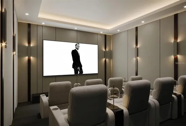 a media room with lots of chairs and a projector