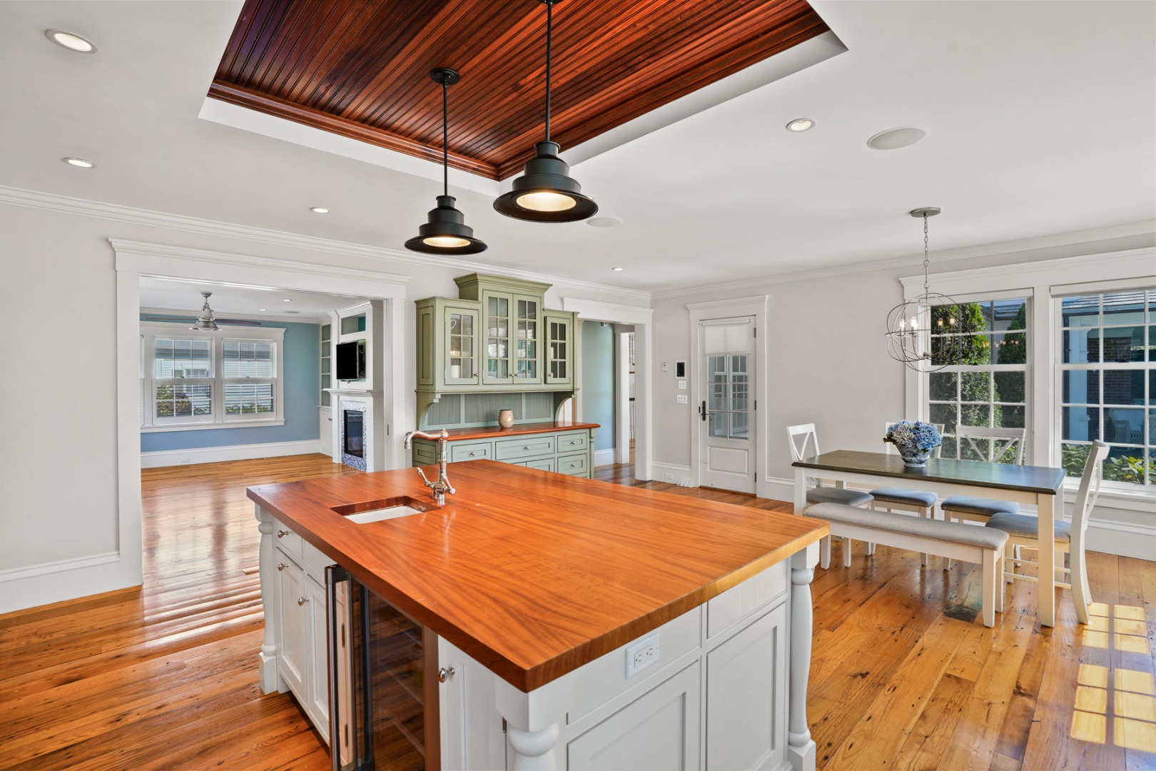 52 South Summer Street Edgartown, MA 02539 - Photo 17 of 51 a room with stainless steel appliances kitchen island granite countertop a stove a sink dishwasher and white cabinets with wooden floor
