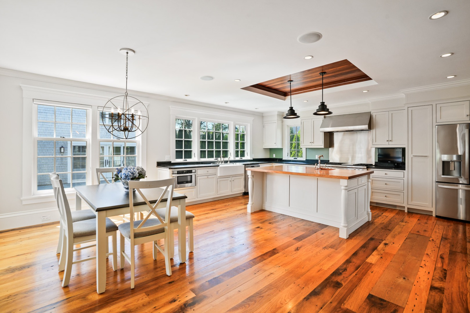 52 South Summer Street Edgartown, MA 02539 - Photo 18 of 51 a kitchen with stainless steel appliances kitchen island granite countertop a sink and cabinets
