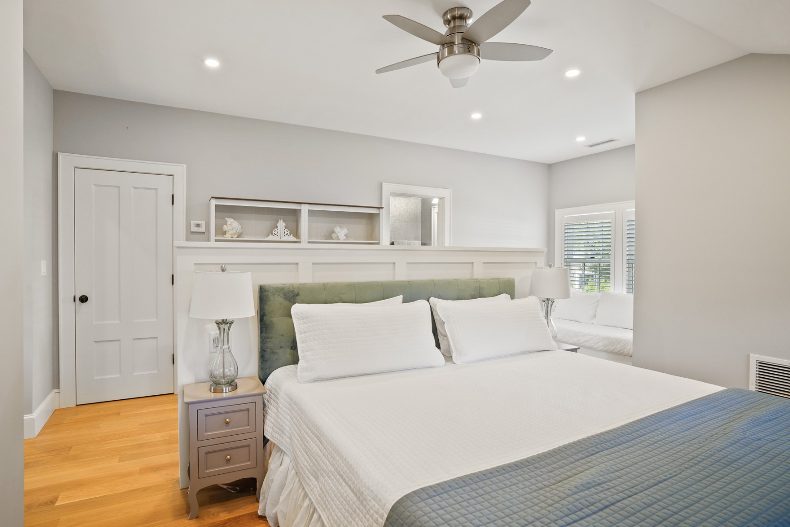 52 South Summer Street Edgartown, MA 02539 - Photo 46 of 51 a bedroom with a bed and a chandelier