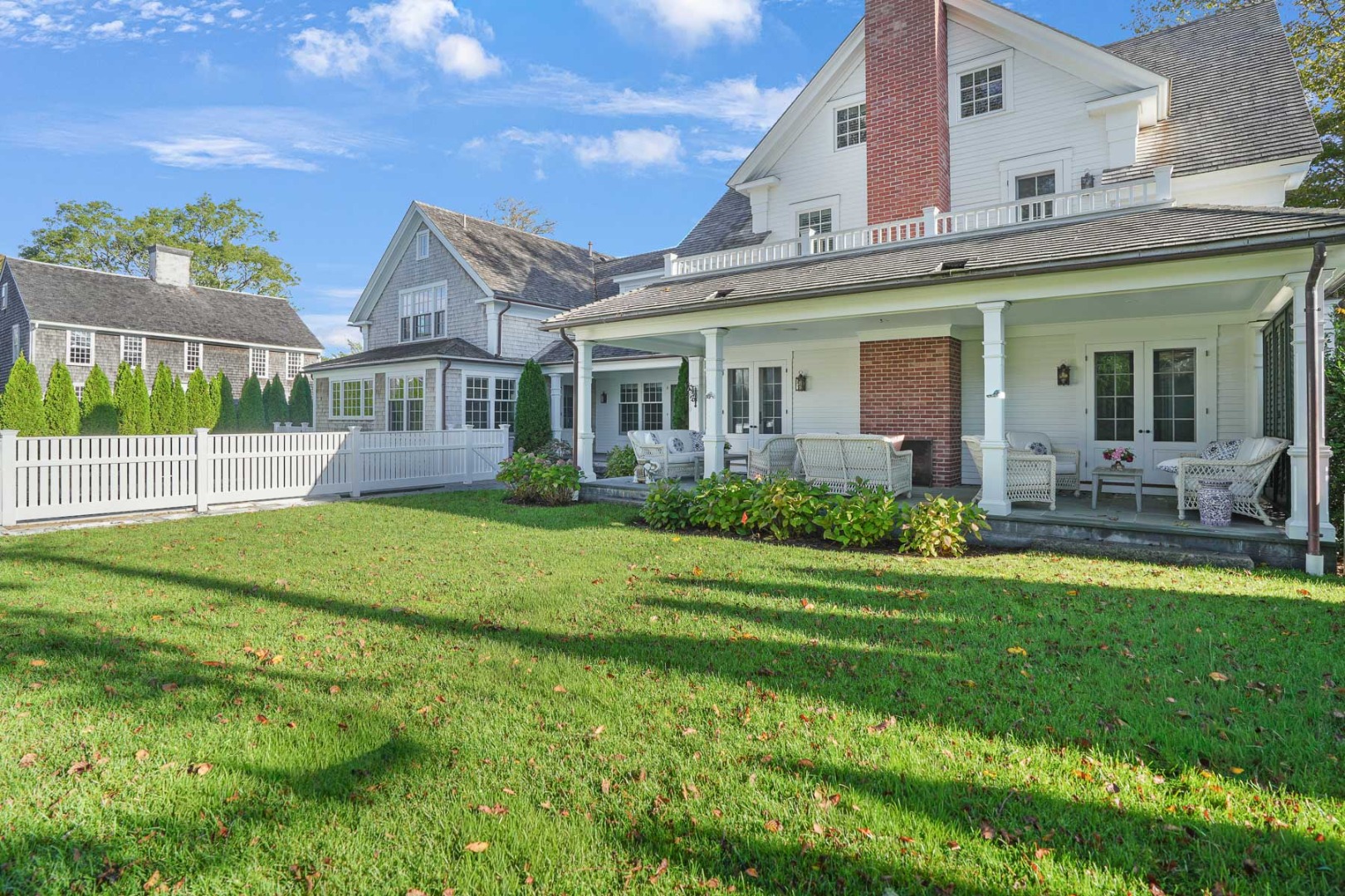 52 South Summer Street Edgartown, MA 02539 - Photo 5 of 51 a front view of a house with a garden and plants