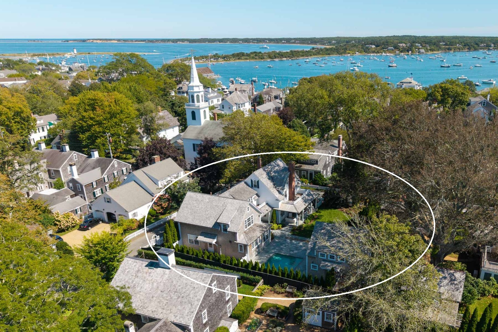 52 South Summer Street Edgartown, MA 02539 - Photo 7 of 51 an aerial view of a house with a garden and lake view