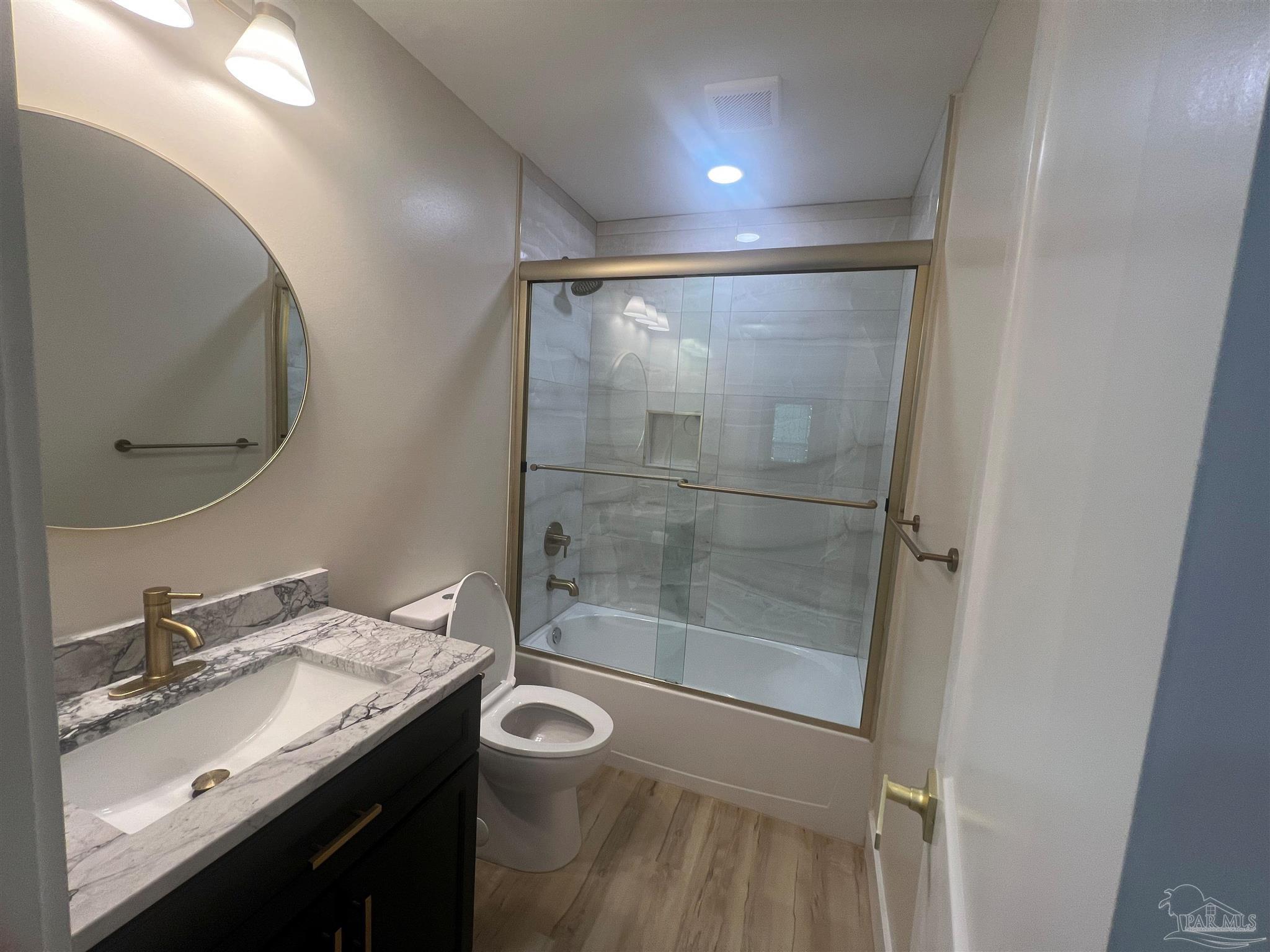 3111 Holley Point Road Navarre, FL 32566 - Photo 9 of 23 a bathroom with a sink and a mirror