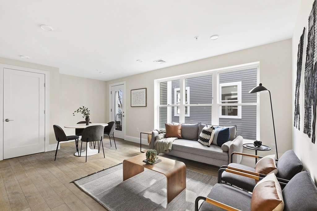 29 Ward Street, Unit 101 Boston, MA 02127 - Photo 3 of 11 a living room with furniture and a window