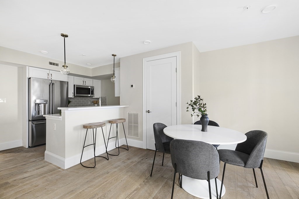29 Ward Street, Unit 101 Boston, MA 02127 - Photo 7 of 11 a view of a dining room with furniture and wooden floor