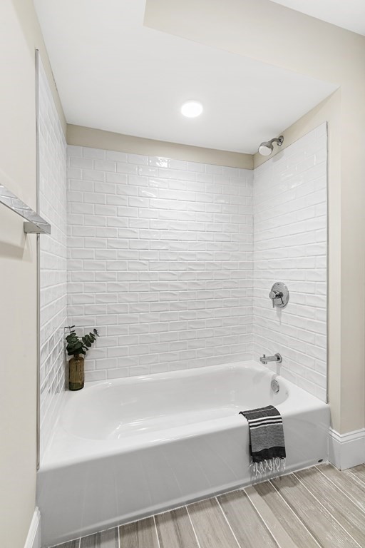29 Ward Street, Unit 101 Boston, MA 02127 - Photo 9 of 11 a bathroom with a bathtub and a shower