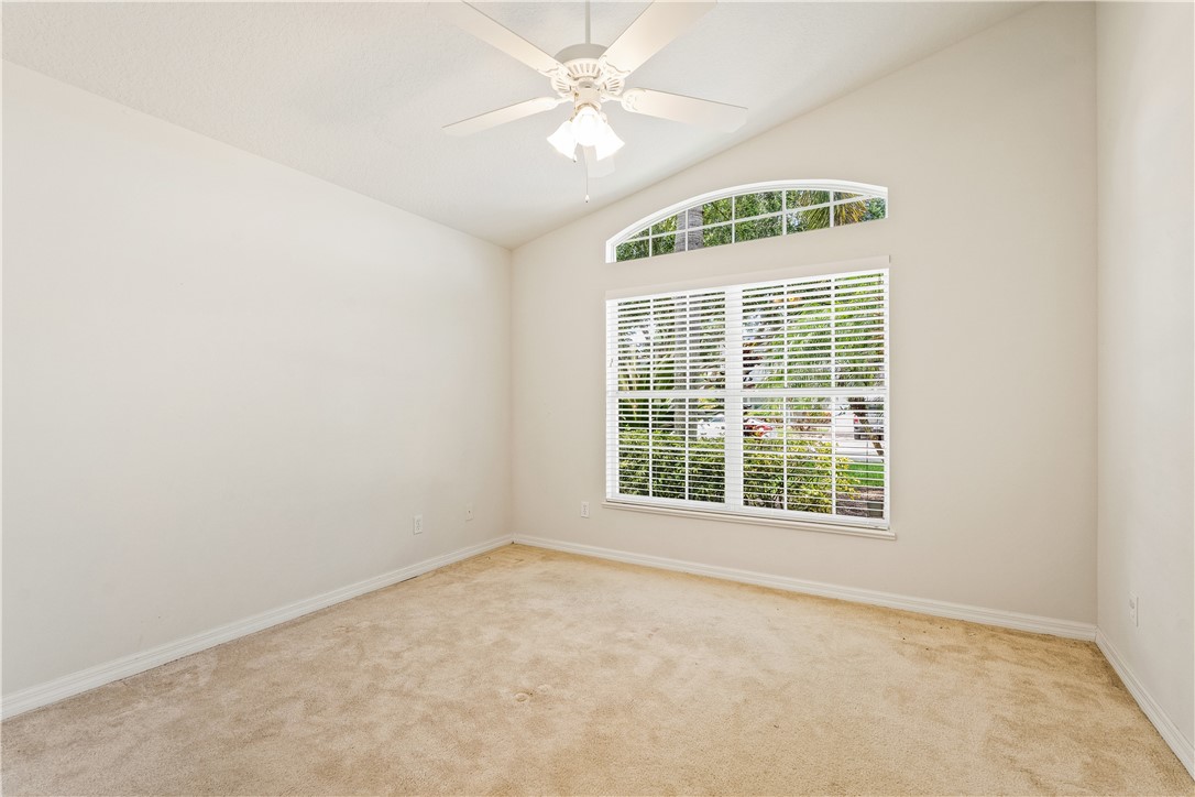 1087 4th Lane Southwest Vero Beach, FL 32962 - Photo 23 of 34 an empty room with windows and fan