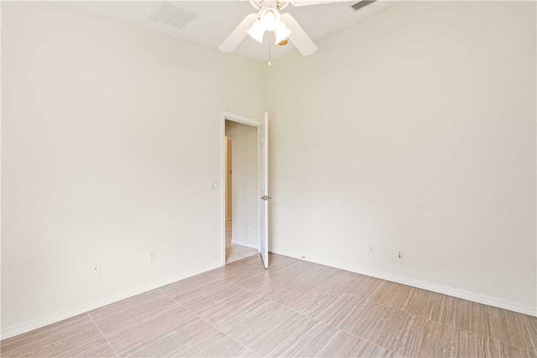 1087 4th Lane Southwest Vero Beach, FL 32962 - Photo 27 of 34 a view of an empty room with wooden floor