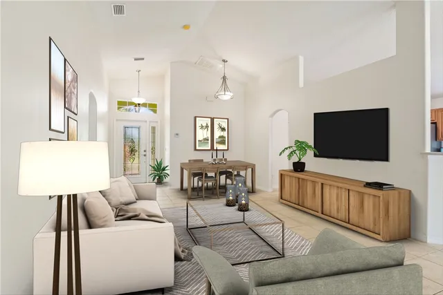 a living room with furniture and a flat screen tv