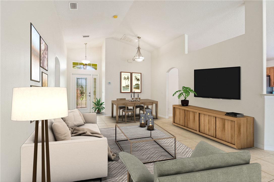 1087 4th Lane Southwest Vero Beach, FL 32962 - Photo 3 of 34 a living room with furniture and a flat screen tv