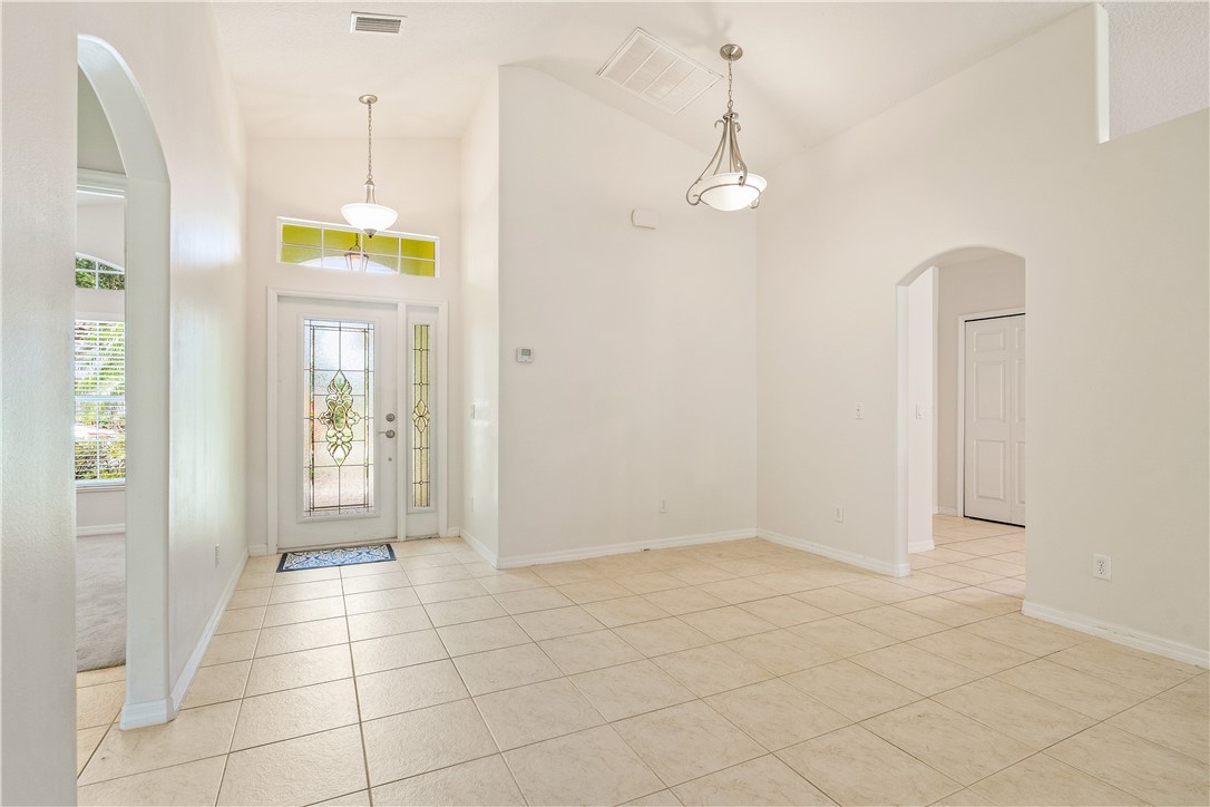 1087 4th Lane Southwest Vero Beach, FL 32962 - Photo 8 of 34 a view of an entryway with wooden floor