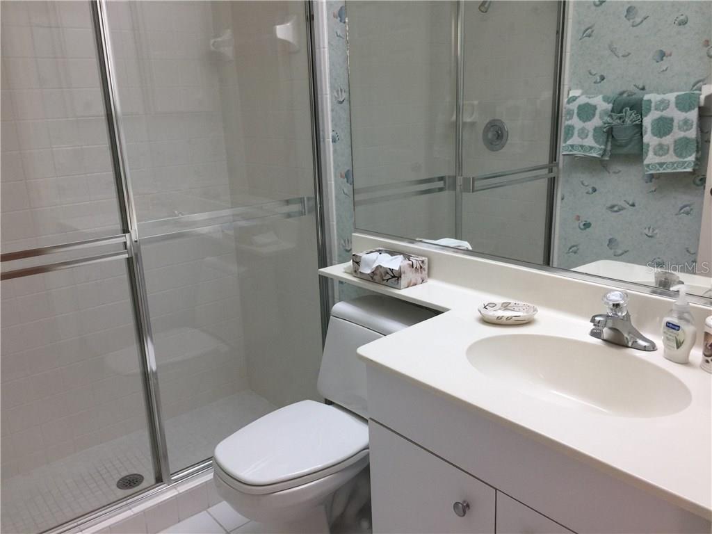 549 Fallbrook Drive Venice, FL 34292 - Photo 15 of 25 a bathroom with a sink toilet and shower